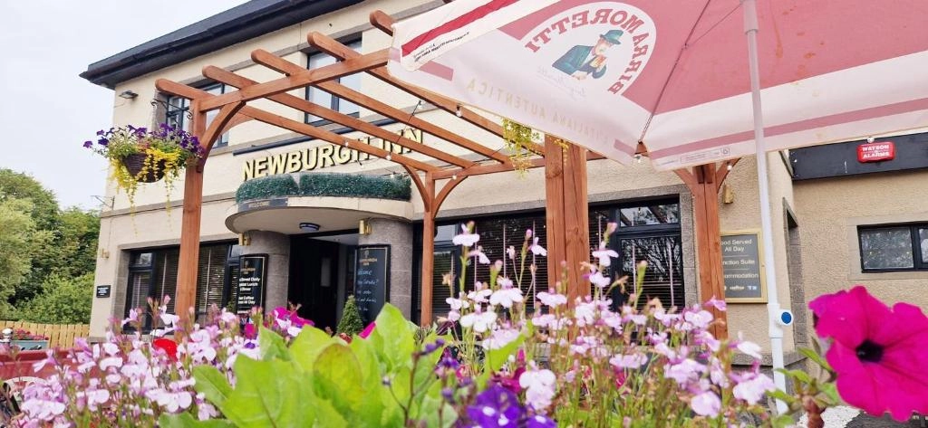 Newburgh Inn exterior with hanging flowers